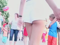 Two lesbian babes are walking around in white shorts