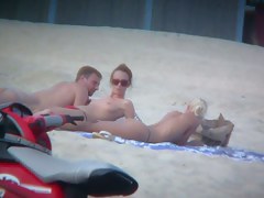 Sexy blonde and naughty brunette on nude beach