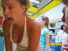 Voyeur upskirt and downblouse shots of two friends in the supermarket