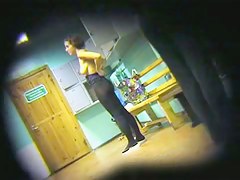 Spy cam in dressing room shoots half nude girl in distance