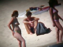Hot ladies with cool butts and small boobs relaxing on the beach