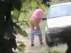 Voyeur camera spying couple having sex in the bushes