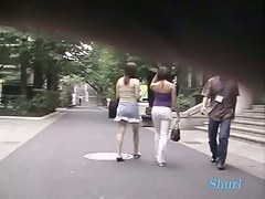 Two perfect Asian chicks are being sharked in a public place