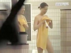 Hidden cam in the shower shooting nice Asian bodies